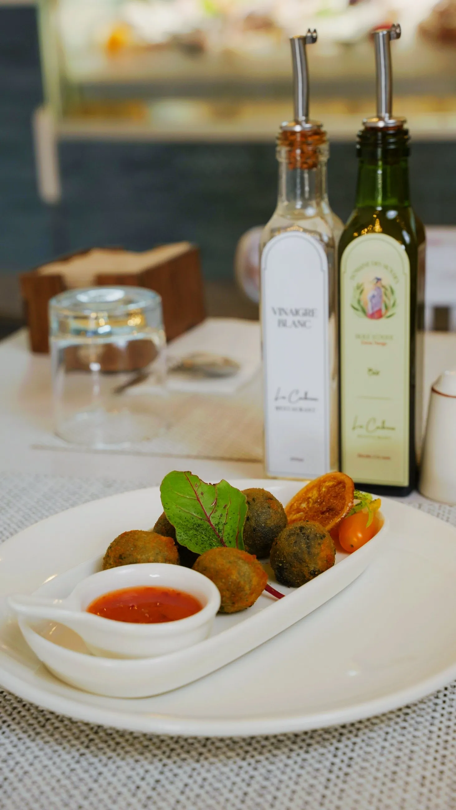 Golden croquettes presented with a bright house sauce