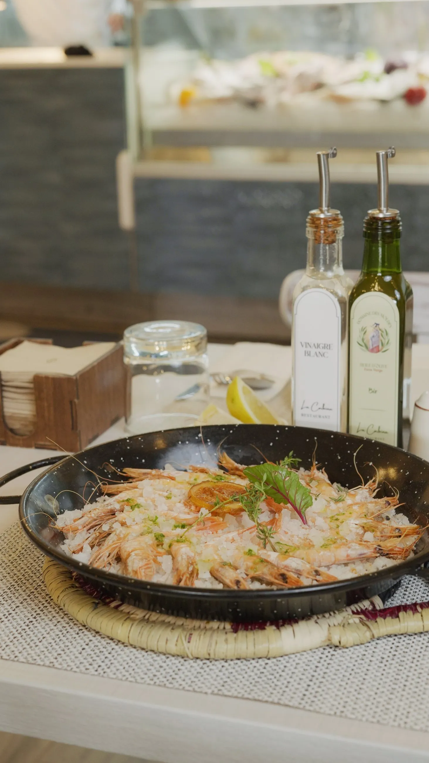 Seafood paella brought to the table in its pan