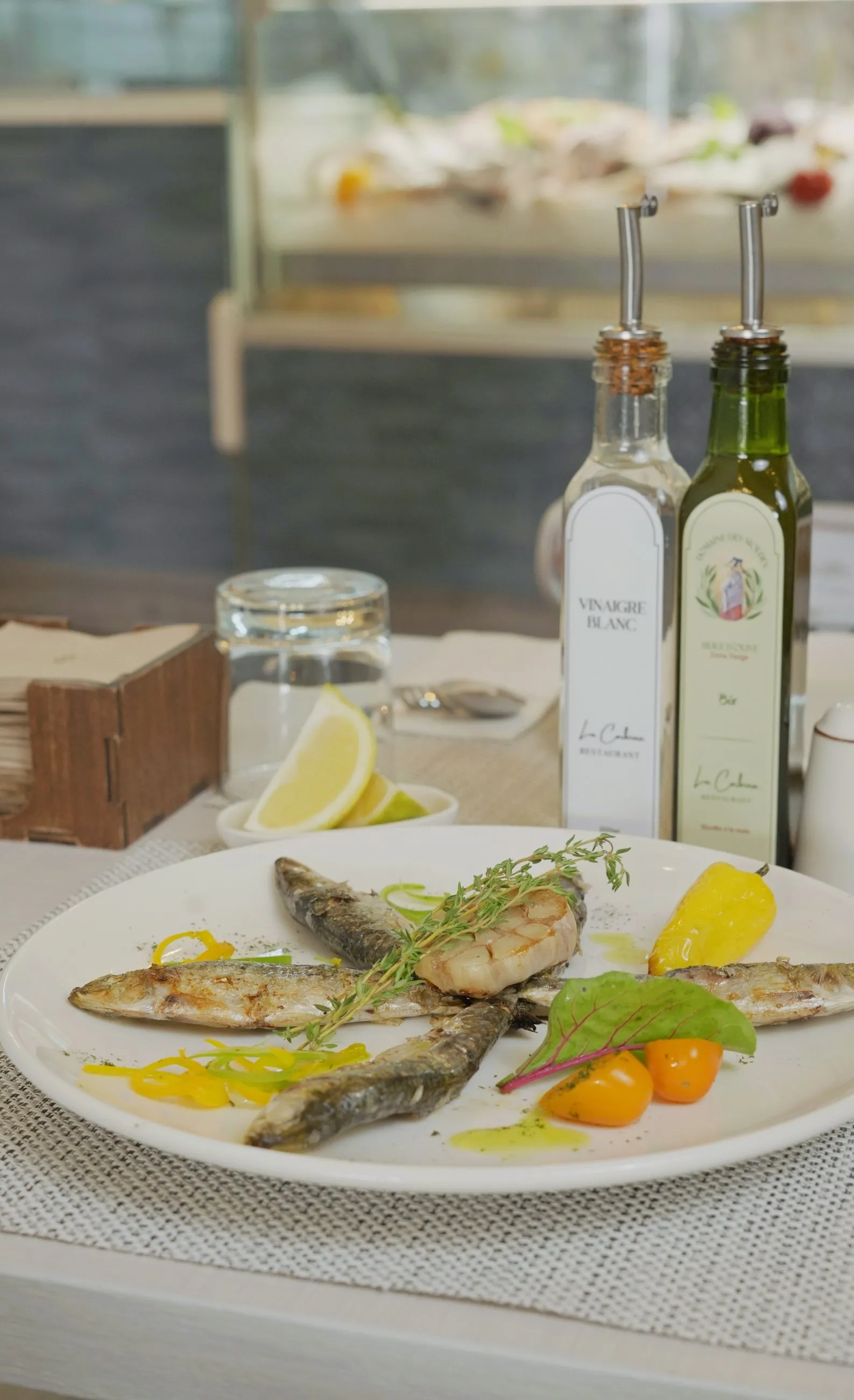 Whole fish grilled and served with seasonal vegetables