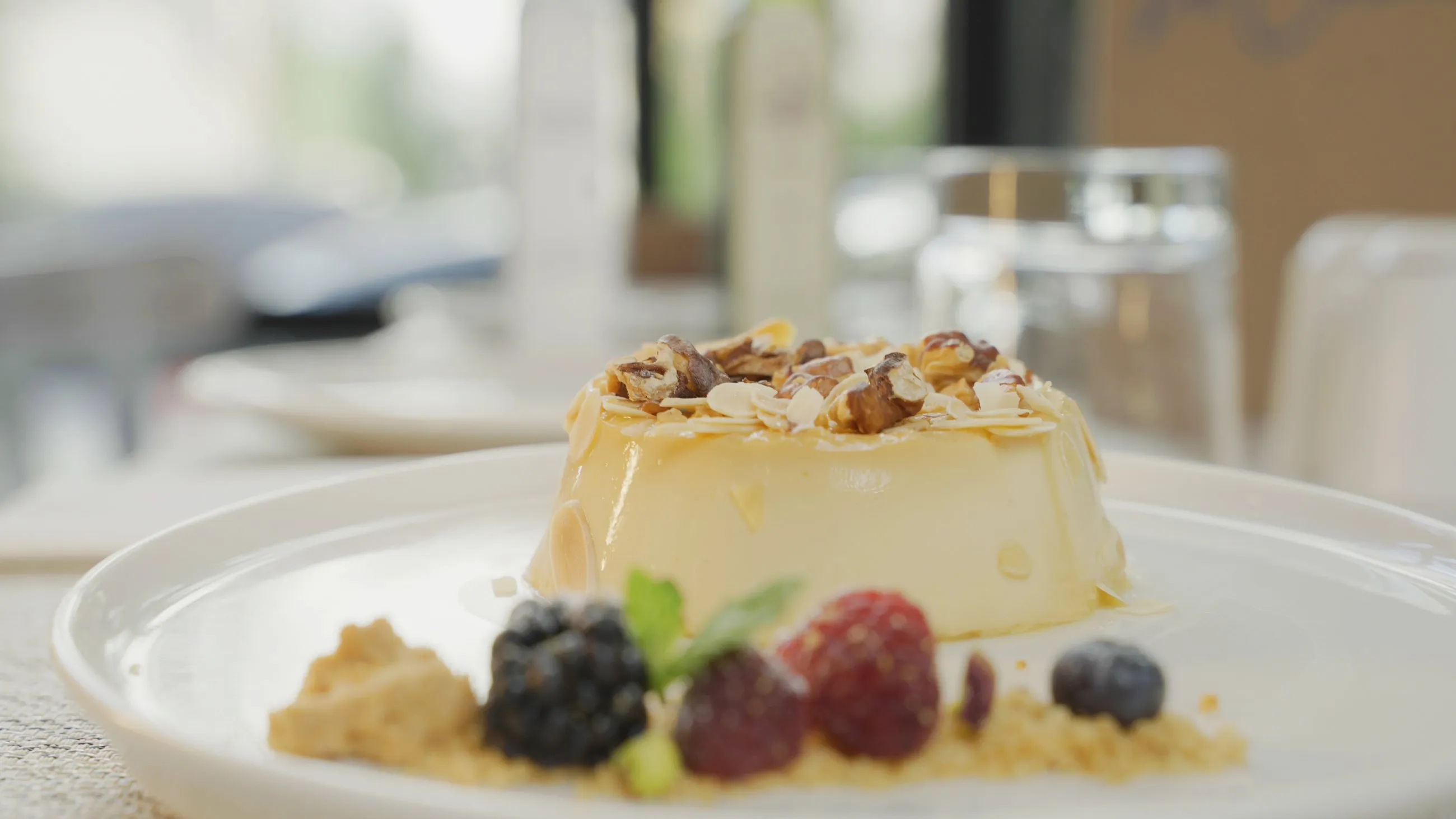 A house dessert finished with fruit and toasted almonds