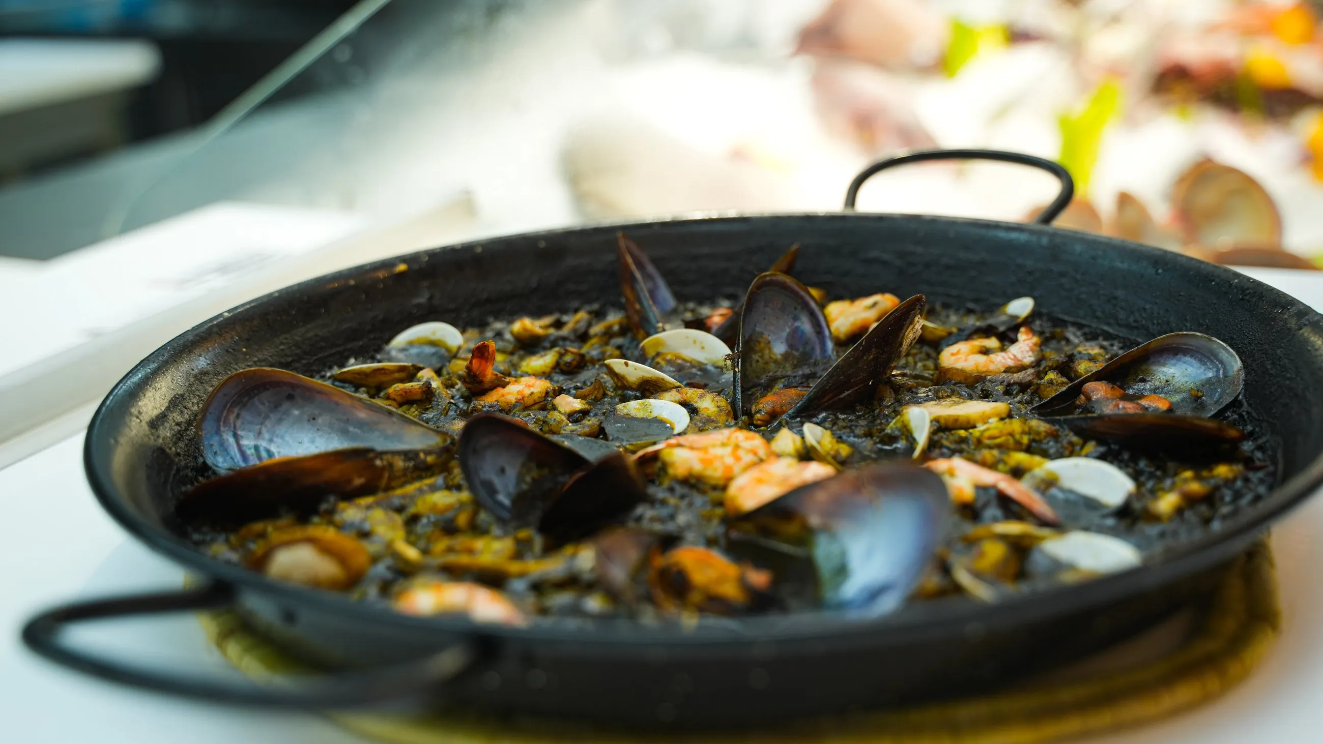Seafood rice with mussels served in a traditional pan