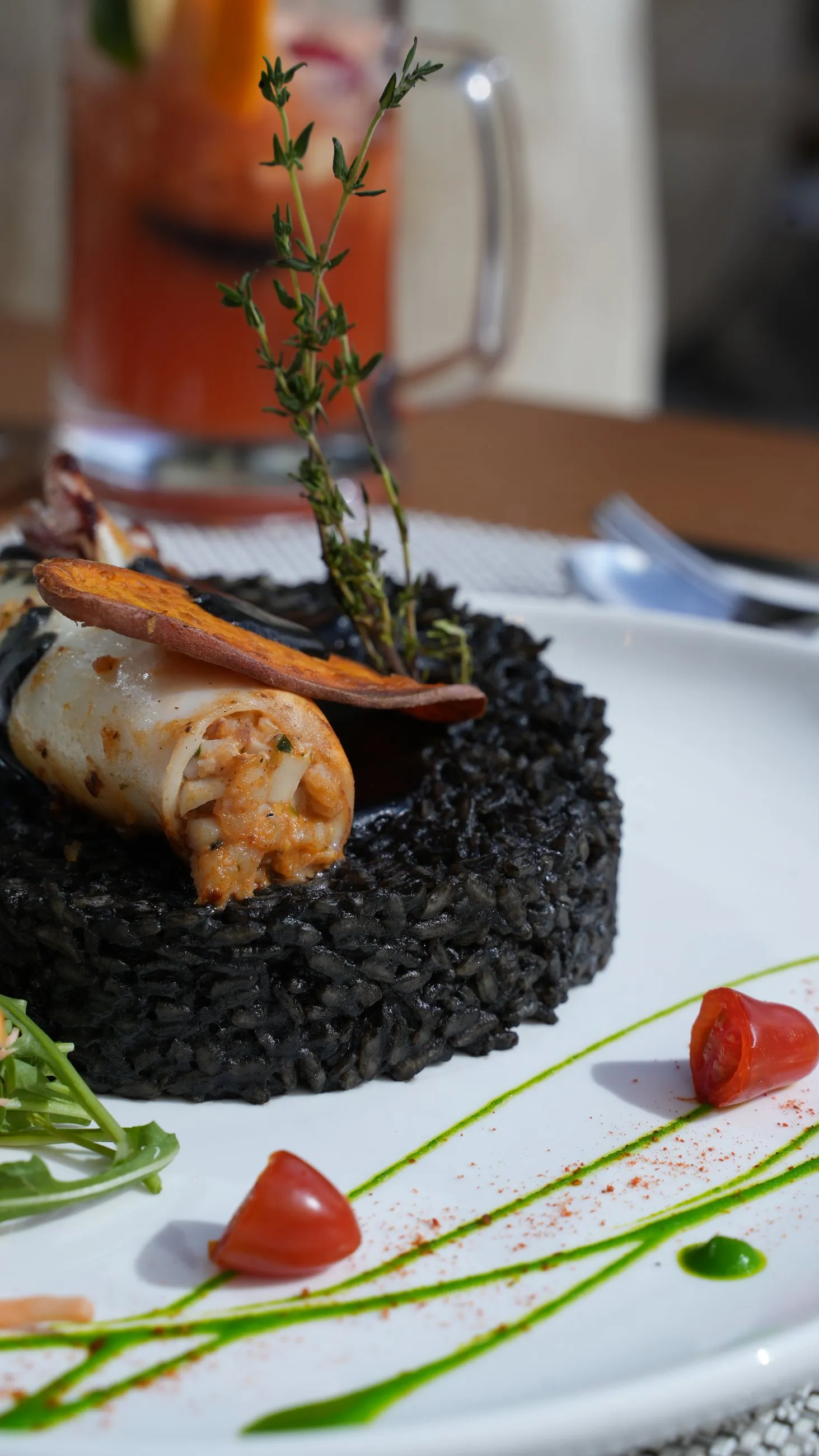 Stuffed squid served over black rice