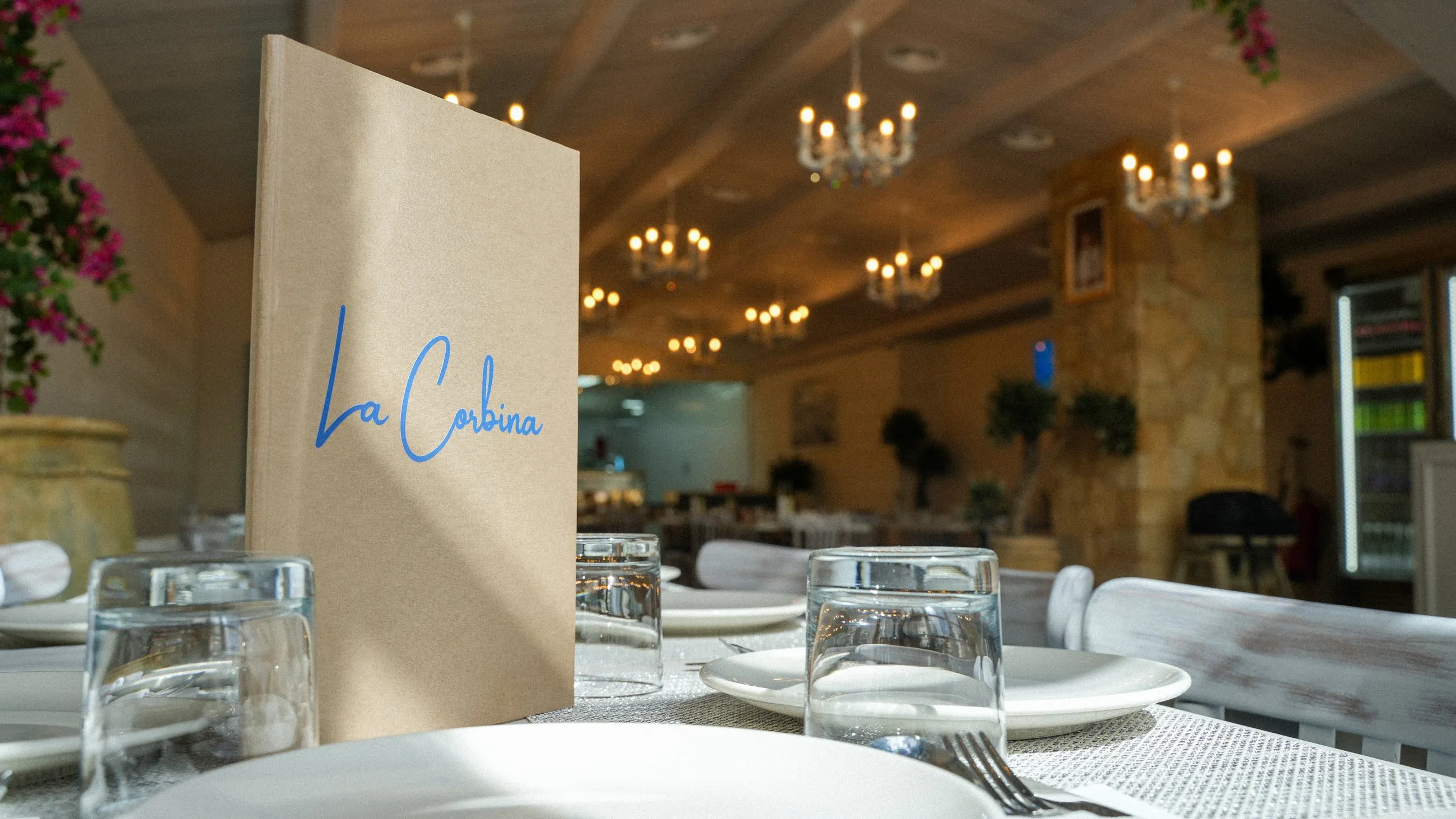 The La Corbina menu on a sunlit table