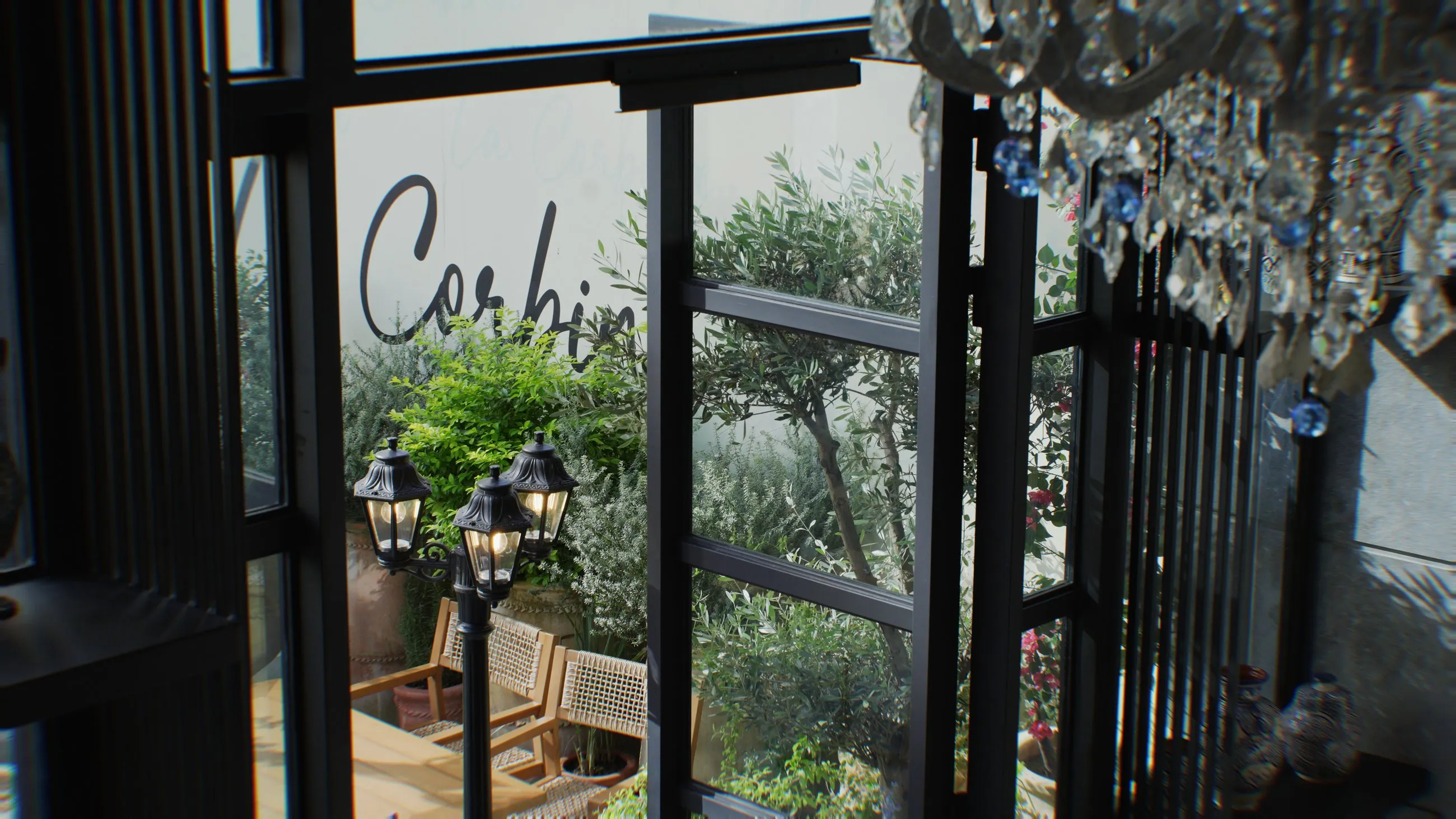 The light-filled entrance and terrace side of La Corbina
