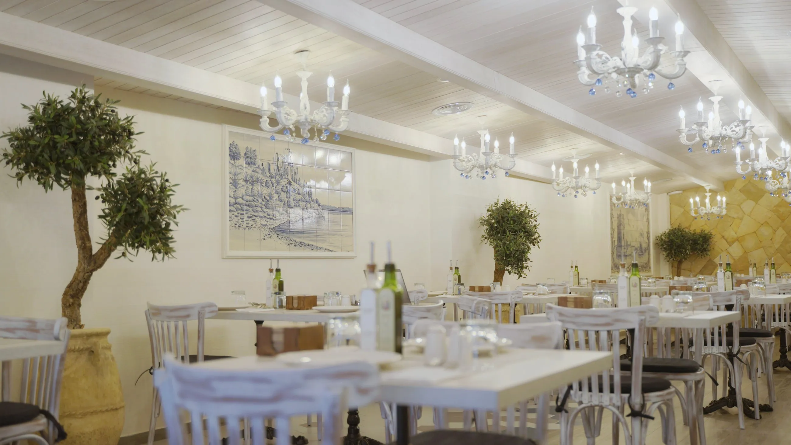 The warm dining room with crystal chandeliers